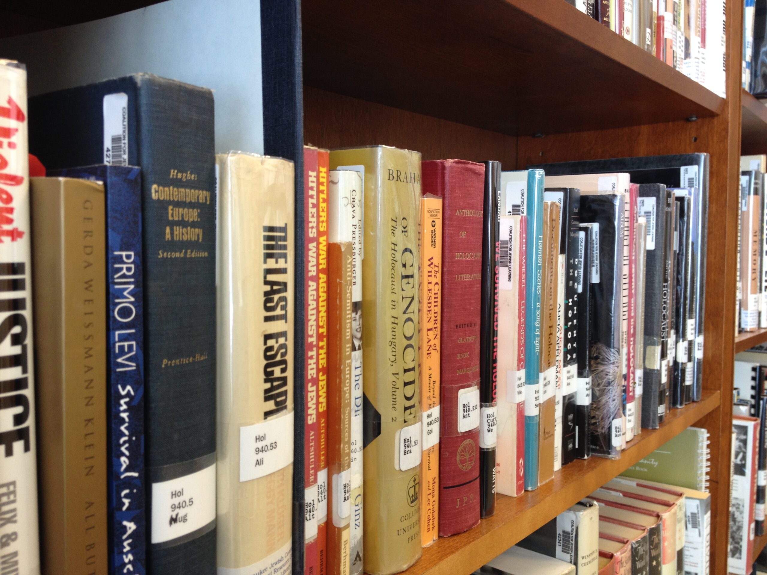 Bookshelf displaying Holocaust education resources available in HERC's lending library
